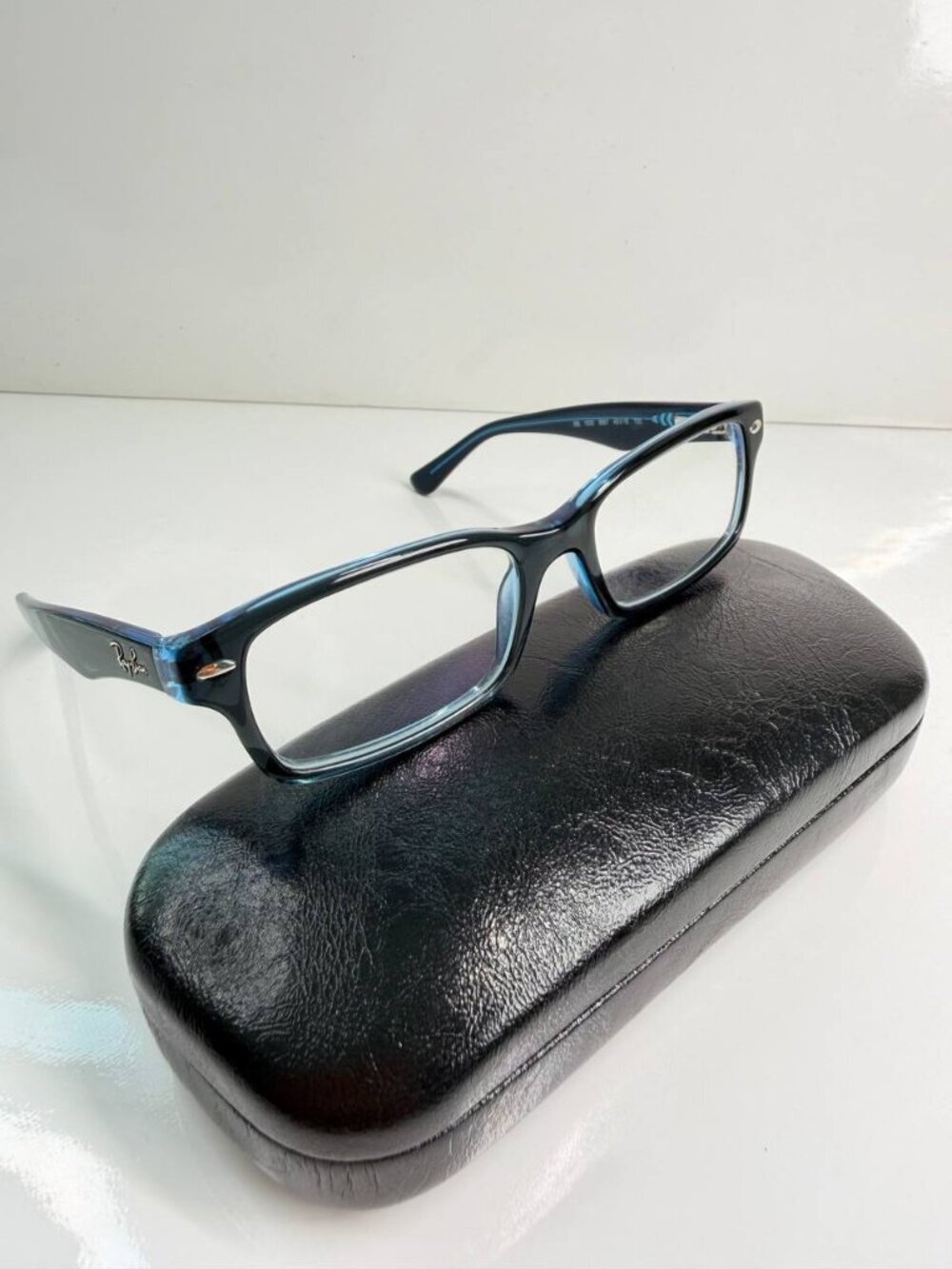 Ray-Ban RB1530 Designer Eyeglasses – Blue Transparent Frame – Includes Hard Case